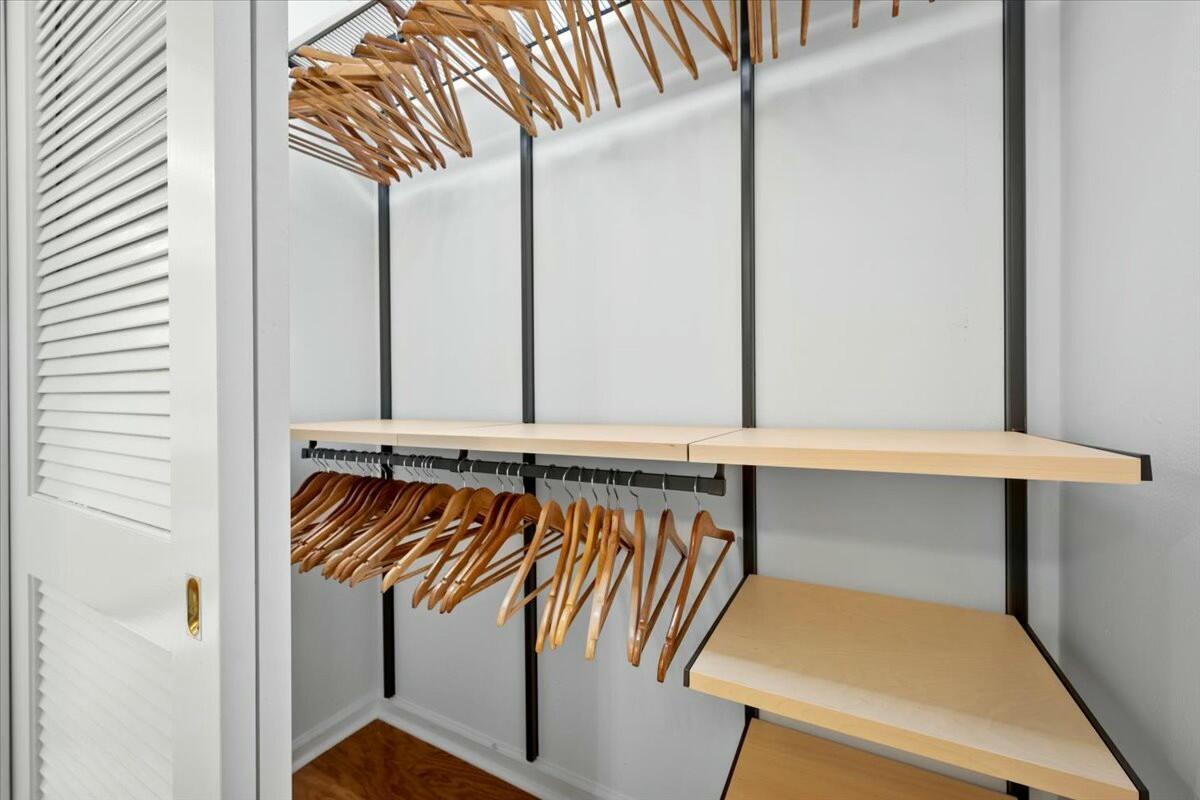 232 Cove Place Jupiter, FL 33469 - Photo 40 of 67 a view of walk in closet with clothes and shoes