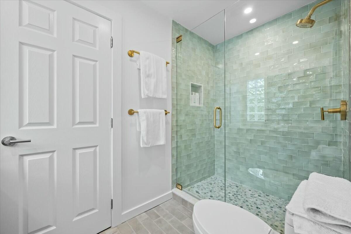 232 Cove Place Jupiter, FL 33469 - Photo 44 of 67 a bathroom with a shower a toilet and a sink