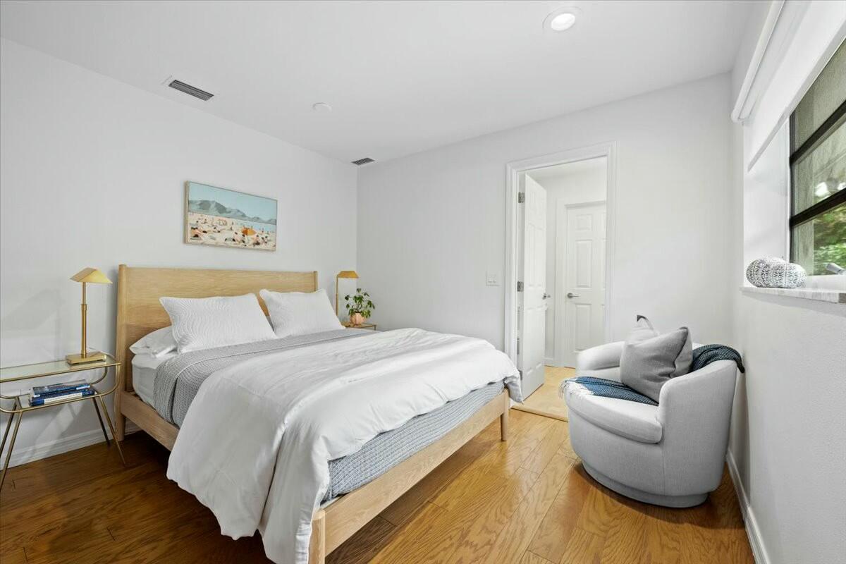 232 Cove Place Jupiter, FL 33469 - Photo 46 of 67 a bedroom with a bed and a couch