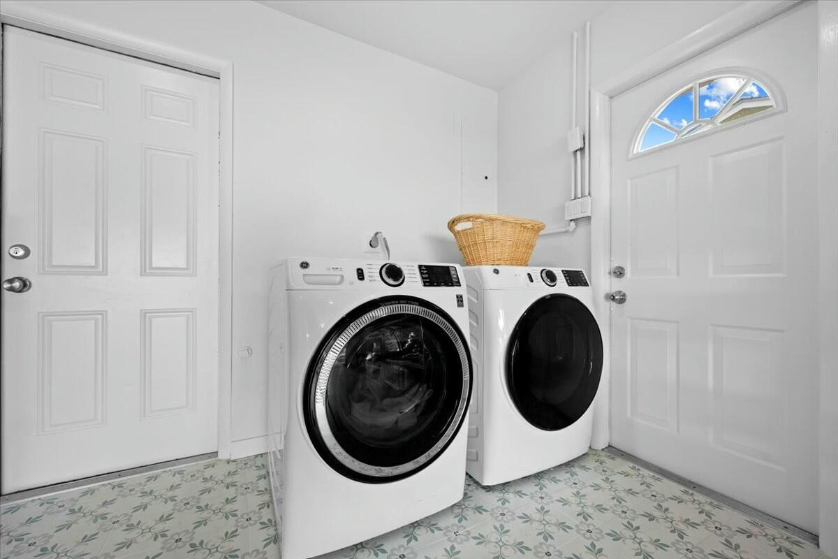 232 Cove Place Jupiter, FL 33469 - Photo 47 of 67 a utility room with dryer and washer