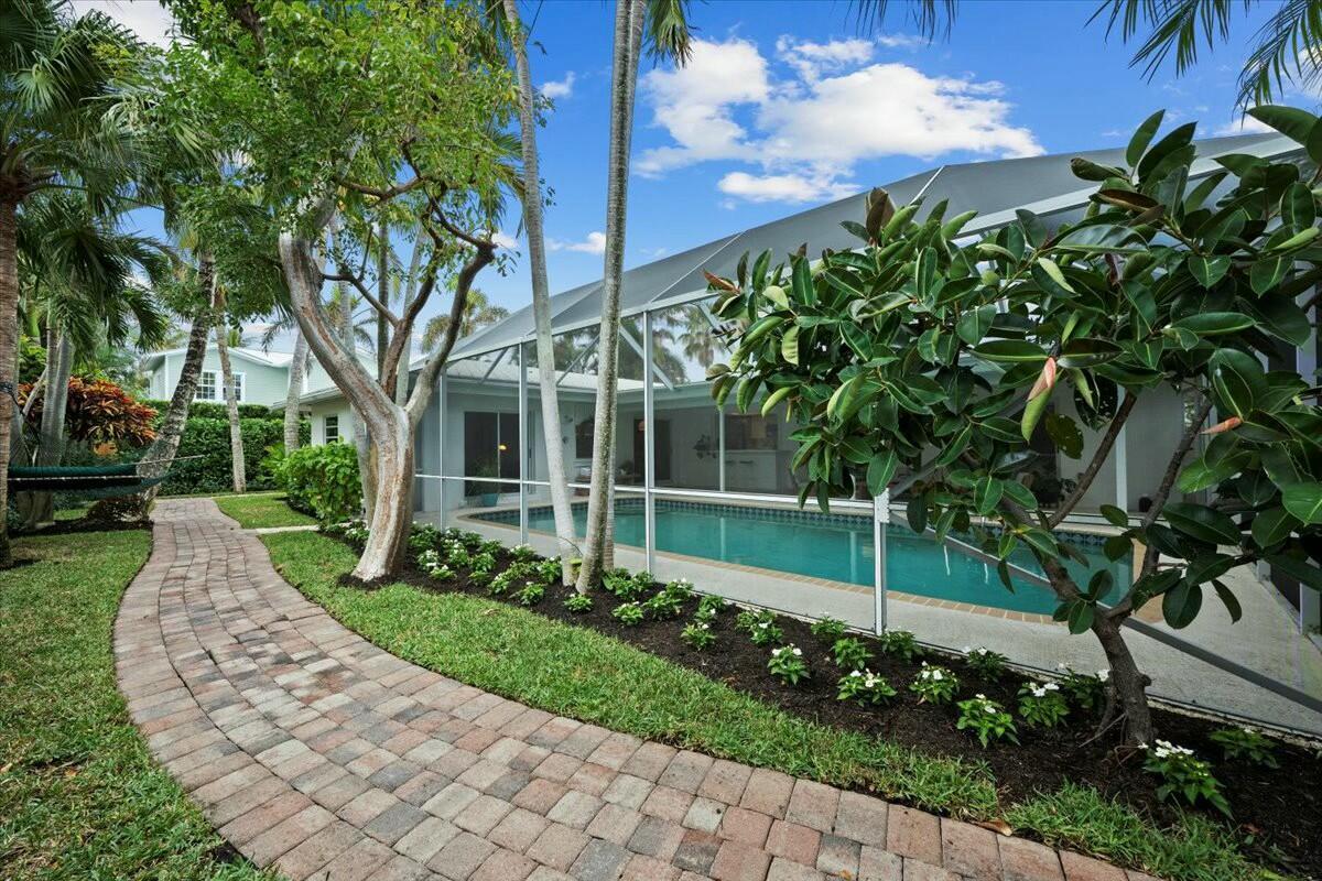 232 Cove Place Jupiter, FL 33469 - Photo 49 of 67 a view of a house with a yard