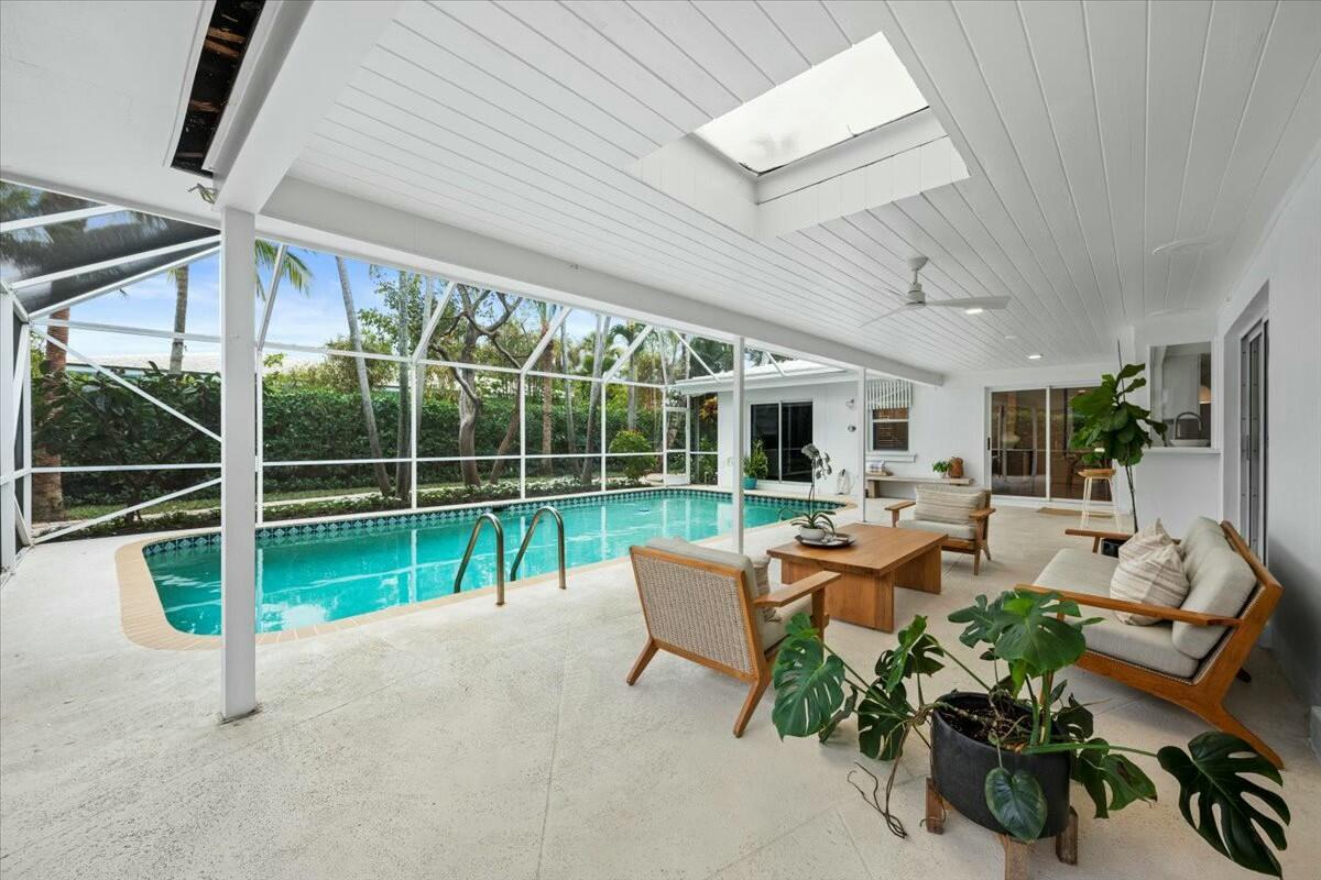 232 Cove Place Jupiter, FL 33469 - Photo 57 of 67 a view of deck with table and chairs potted plants with wooden floor