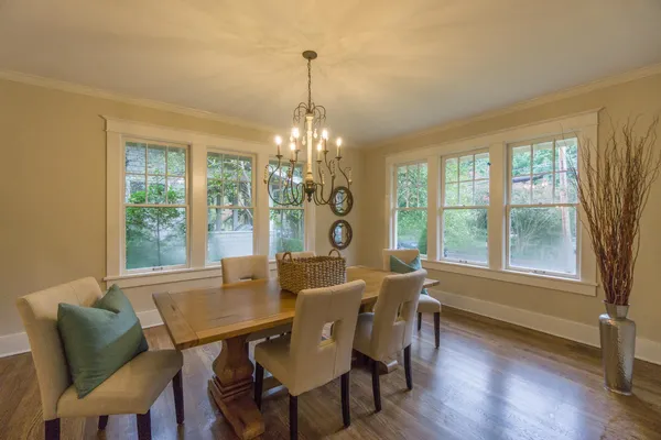 a view of a dining room with furniture and wooden floor