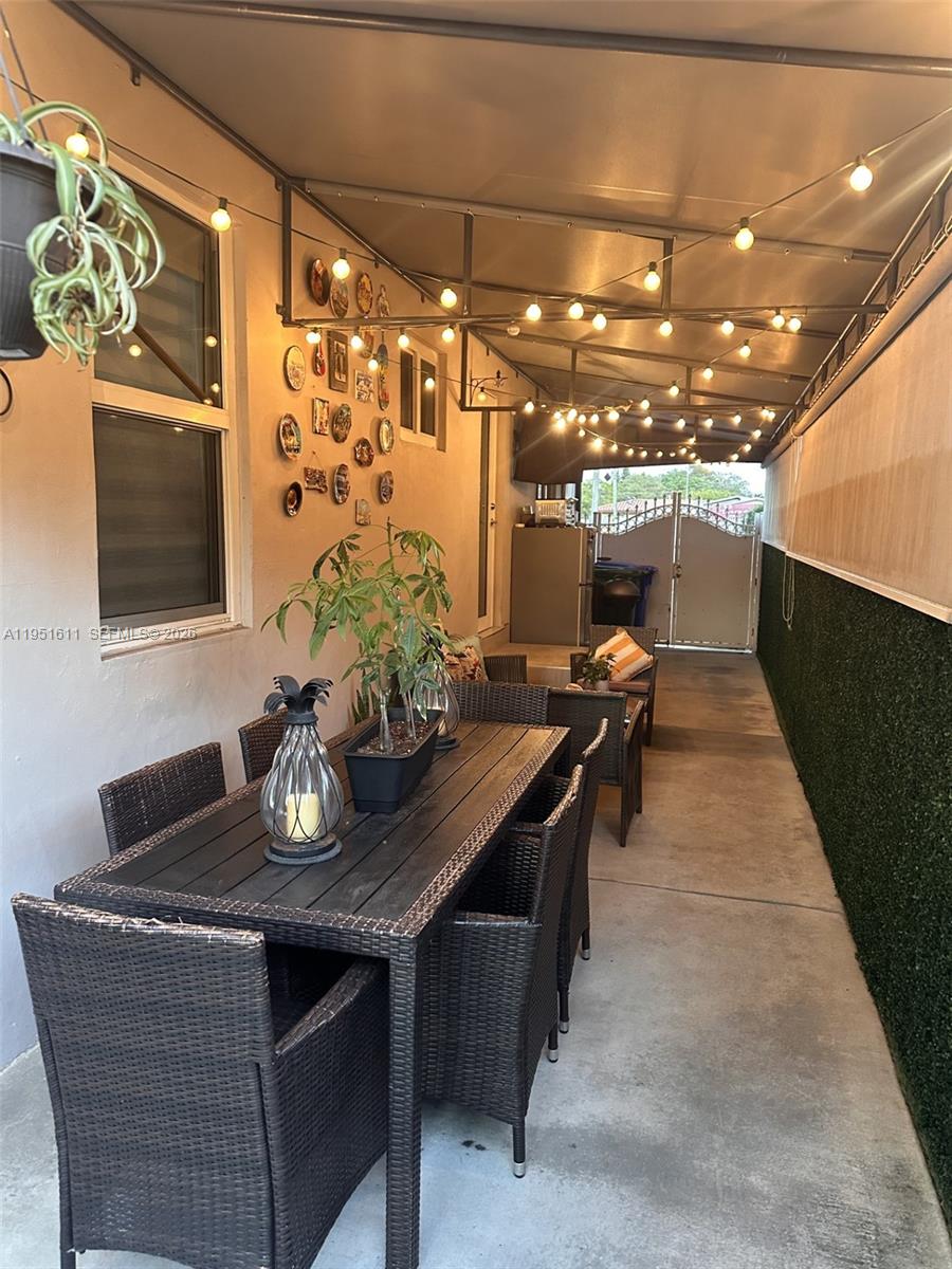 4485 Southwest 7th Street Miami, FL 33134 - Photo 16 of 26 a dining room with furniture and chandelier