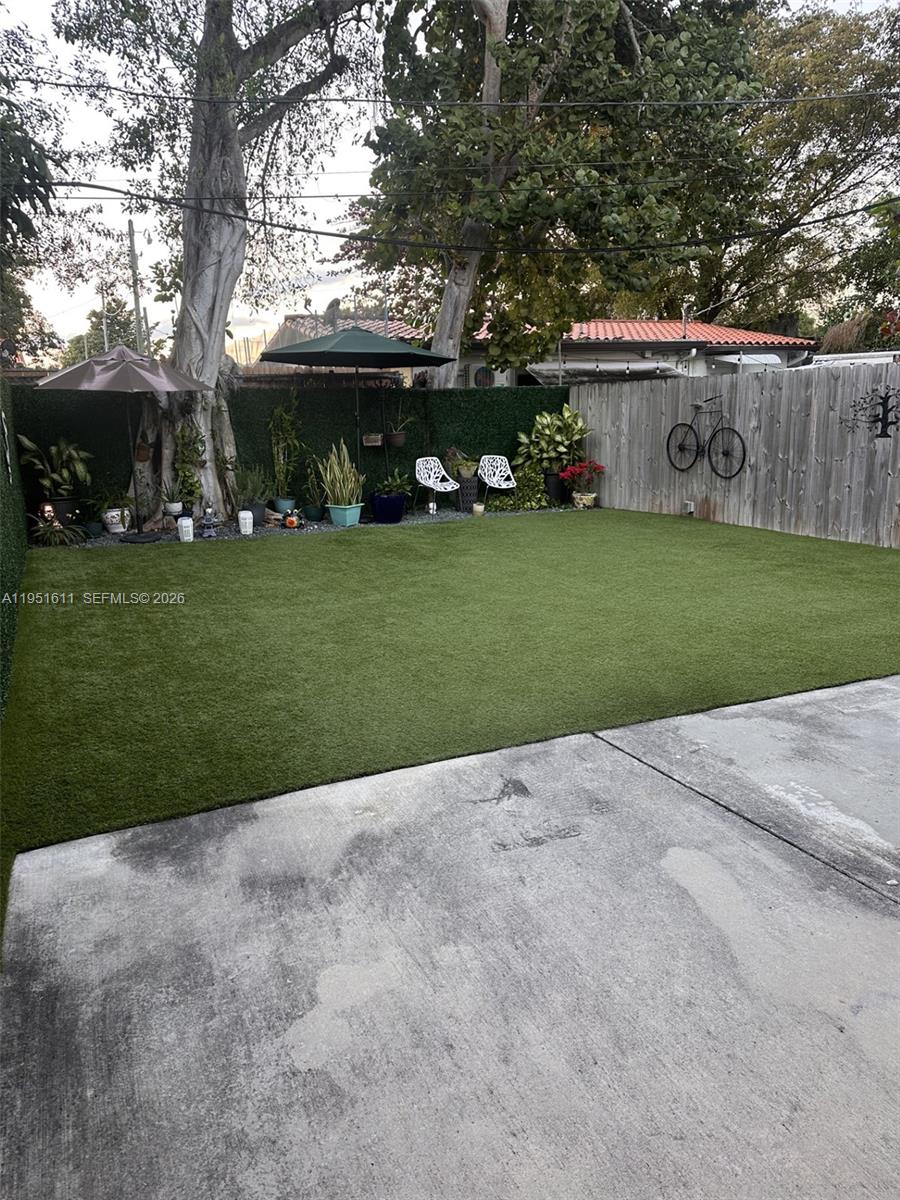 4485 Southwest 7th Street Miami, FL 33134 - Photo 17 of 26 a view of a house with a garden and pathway