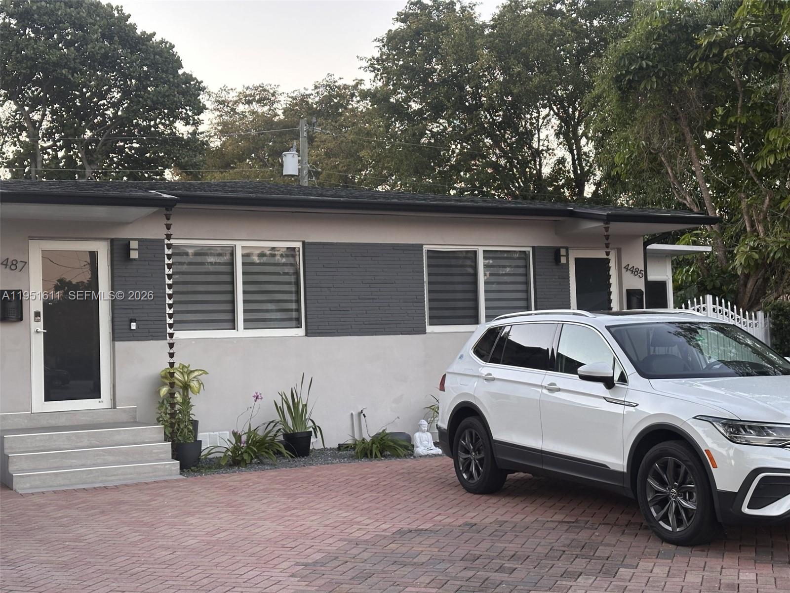 4485 Southwest 7th Street Miami, FL 33134 - Photo 2 of 26 a car parked in front of a house