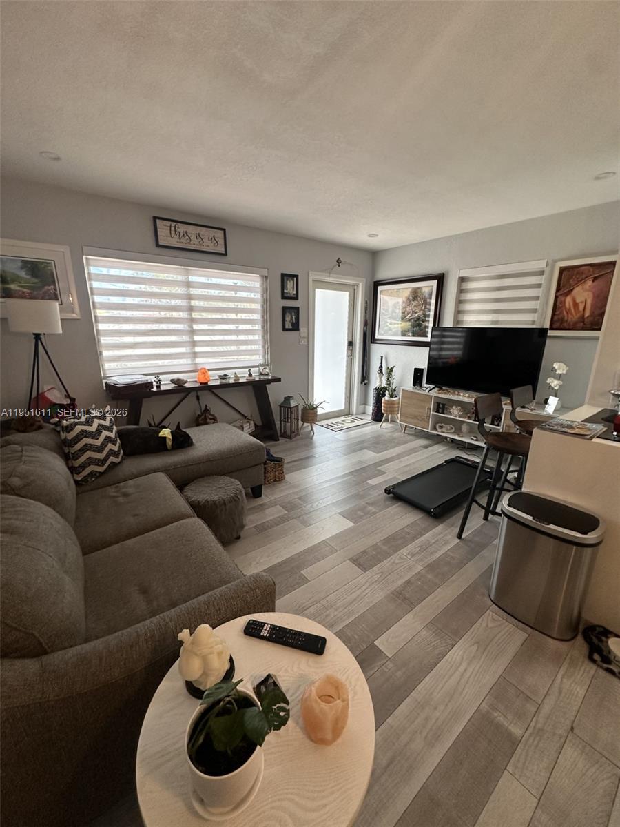 4485 Southwest 7th Street Miami, FL 33134 - Photo 22 of 26 a living room with furniture and a window
