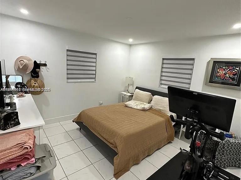 4485 Southwest 7th Street Miami, FL 33134 - Photo 9 of 26 a bedroom with a bed and a window