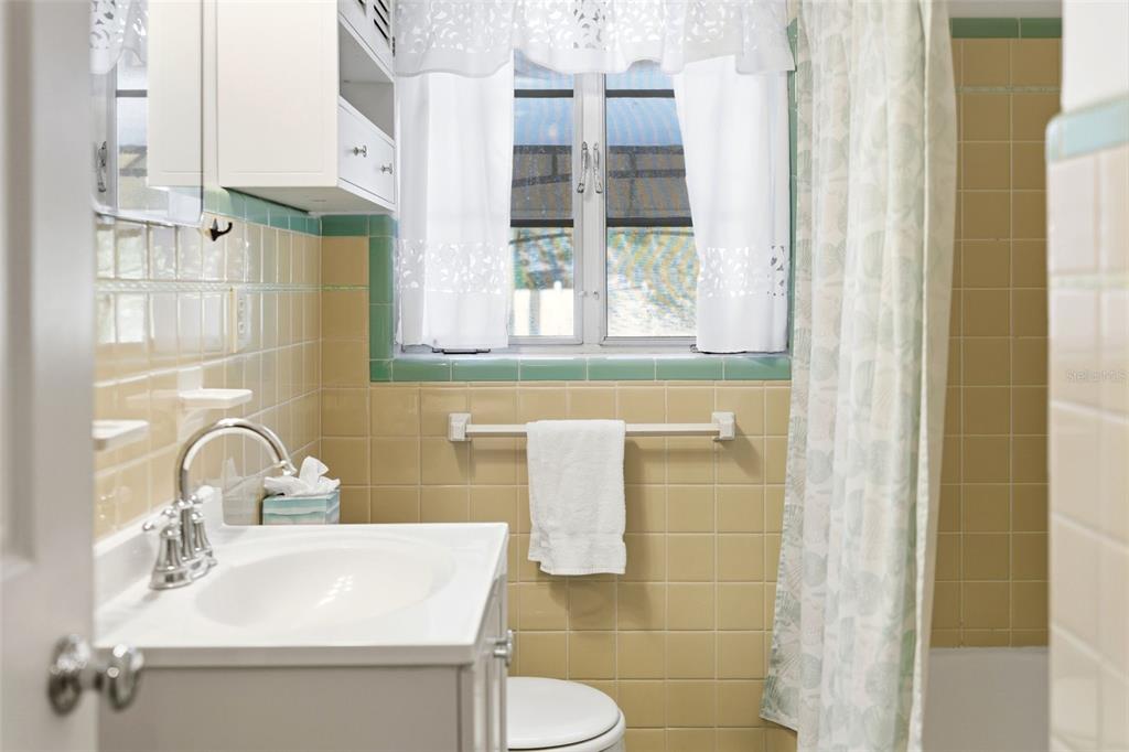 1715 Canton Street Orlando, FL 32803 - Photo 20 of 31 a bathroom with a sink and a mirror