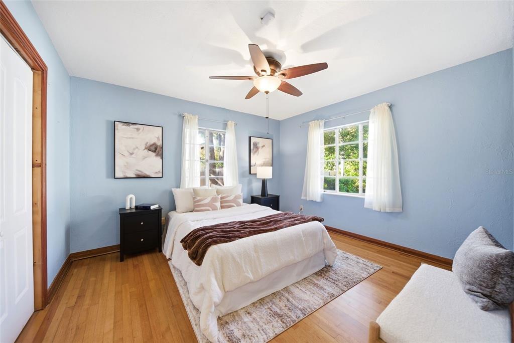 1715 Canton Street Orlando, FL 32803 - Photo 21 of 31 a bedroom with a bed and wooden floor