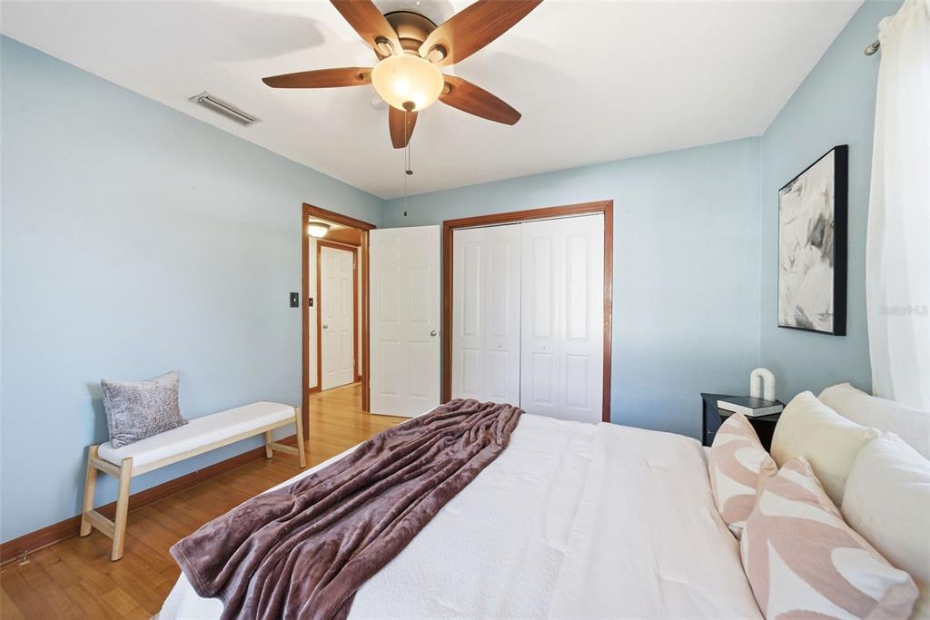 1715 Canton Street Orlando, FL 32803 - Photo 22 of 31 a bedroom with a bed and a chandelier