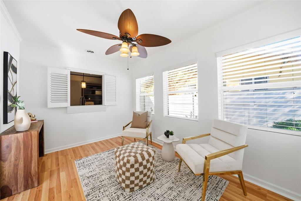 1715 Canton Street Orlando, FL 32803 - Photo 4 of 31 a bedroom with a bed and wooden floor