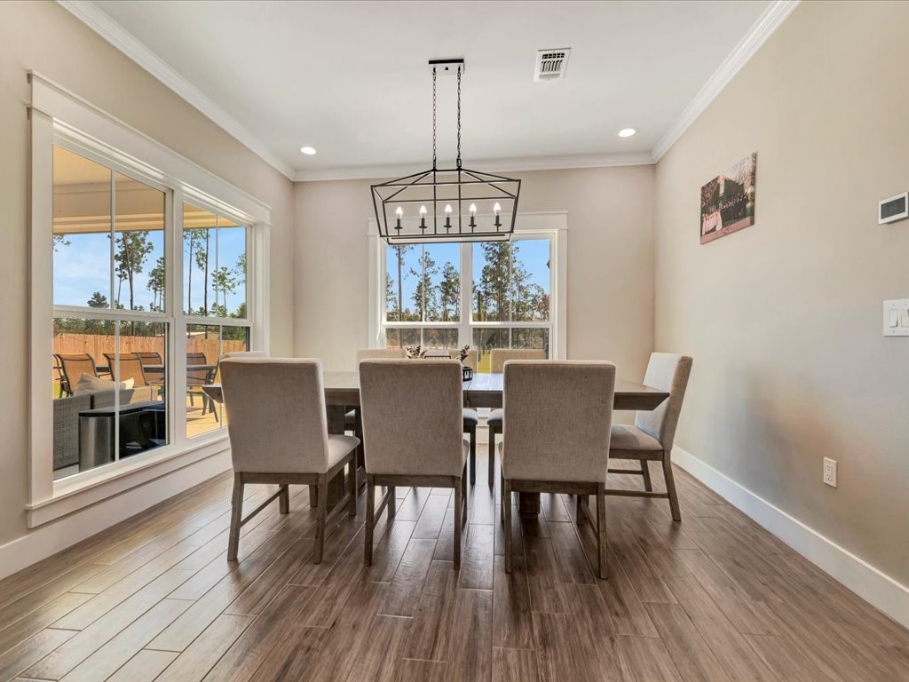 387 C C Road Diboll, TX 75941 - Photo 24 of 50 a view of a dining room with furniture window and wooden floor