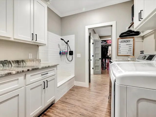a kitchen with stainless steel appliances granite countertop a sink and cabinets