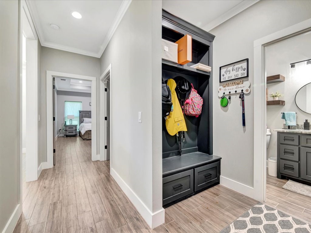 387 C C Road Diboll, TX 75941 - Photo 42 of 50 a view of a hallway and a livingroom with wooden floor and a bathroom