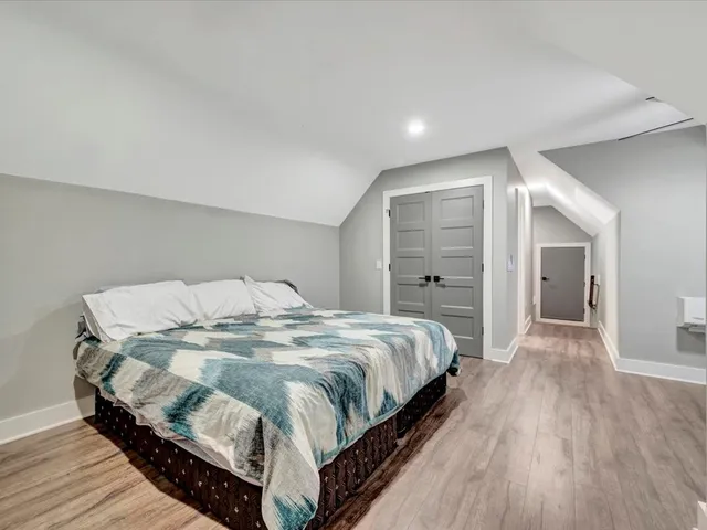 a bedroom with a bed and window