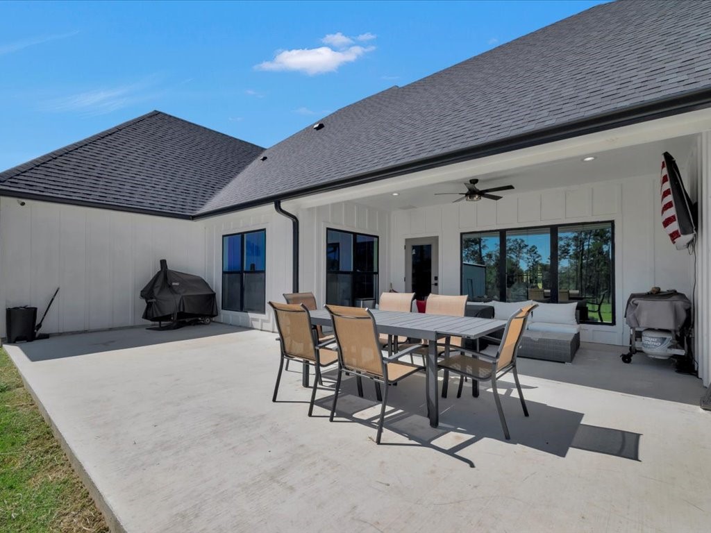 387 C C Road Diboll, TX 75941 - Photo 47 of 50 a patio with table and chairs and potted plants