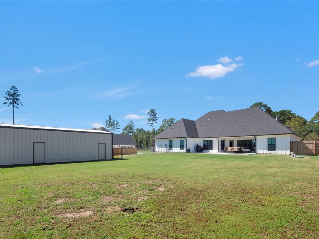 387 C C Road Diboll, TX 75941 - Photo 48 of 50 a front view of a house with a garden and yard