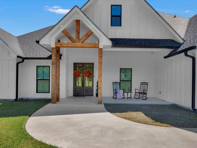 a front view of a house with a porch