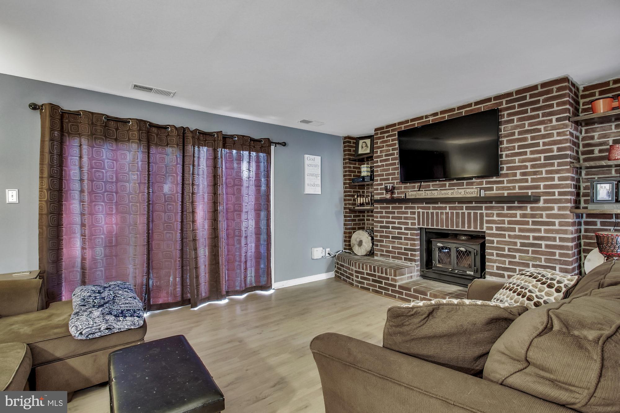 209 Haverhill Road Joppa, MD 21085 - Photo 12 of 26 Living Room with wood burning fireplace