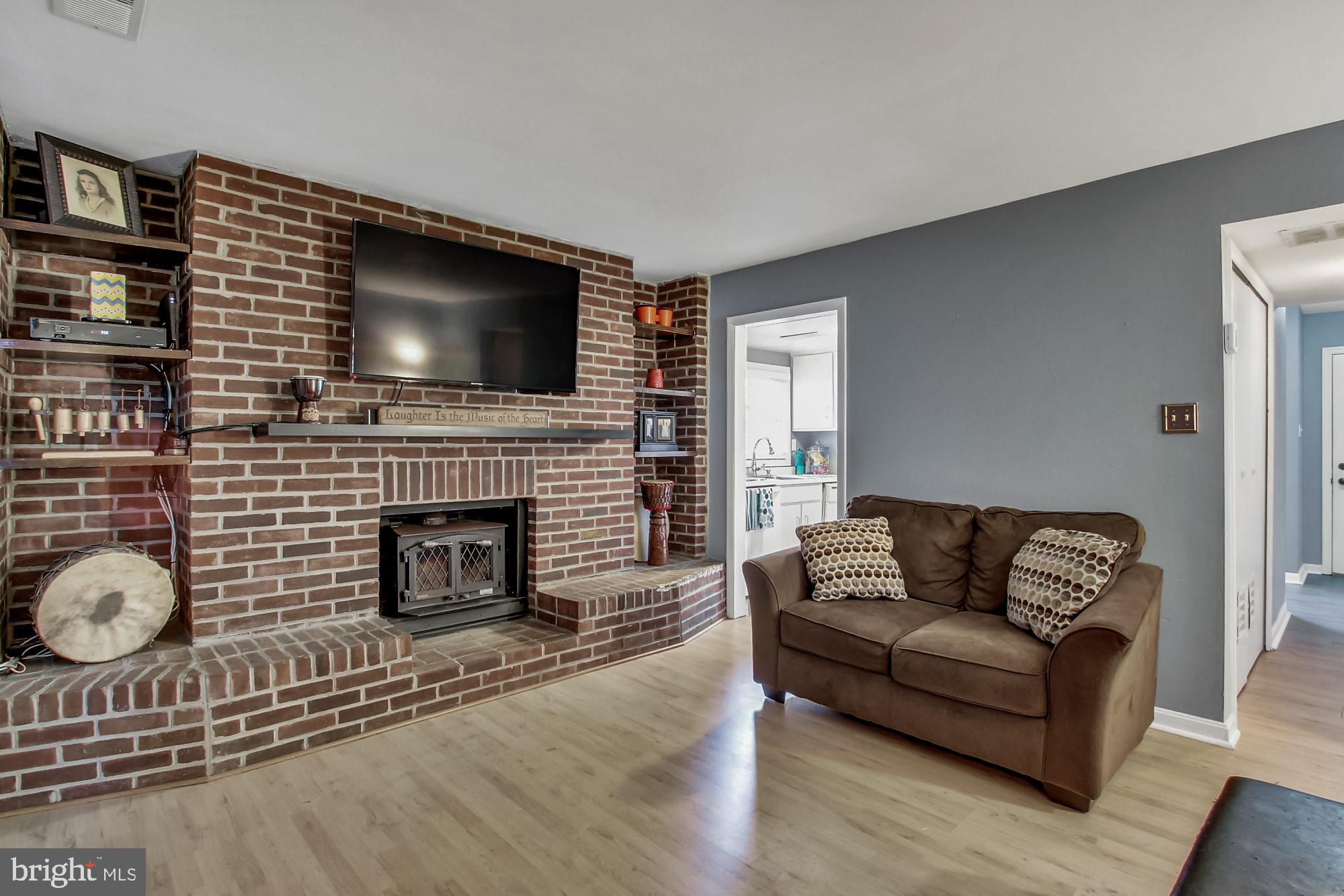 209 Haverhill Road Joppa, MD 21085 - Photo 13 of 26 Living Room with wood burning fireplace