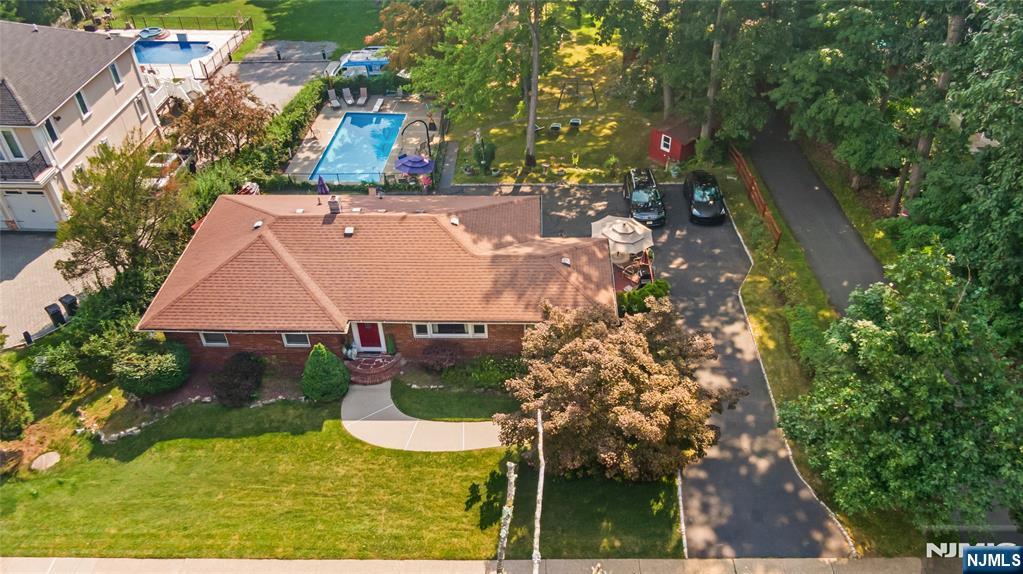 1468 Alps Road Wayne, NJ 07470 - Photo 1 of 36 an aerial view of residential house with outdoor space and trees all around