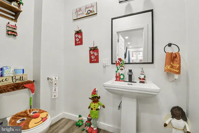 a bathroom with a sink mirror and vanity
