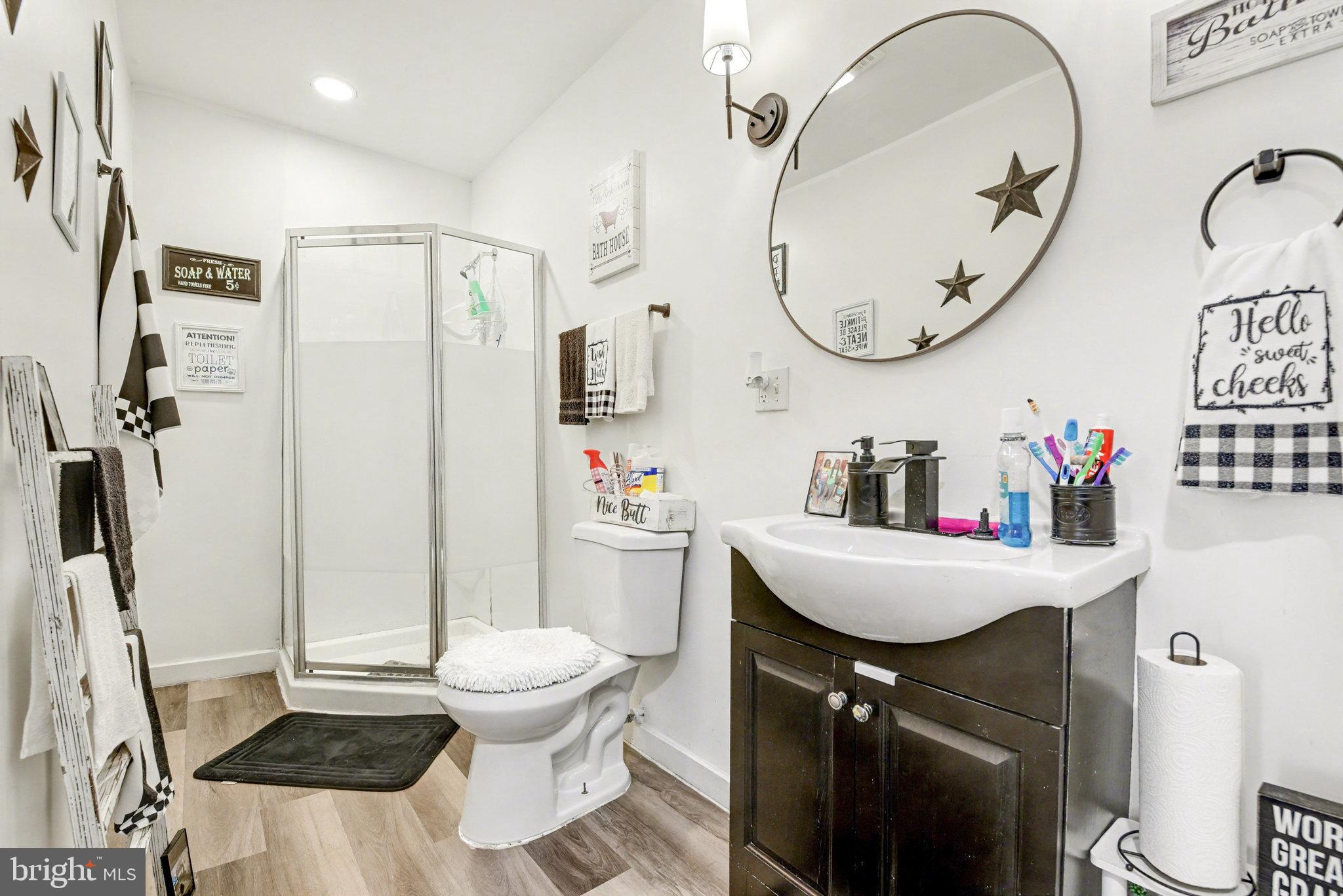 2141 Penn Street Harrisburg, PA 17110 - Photo 15 of 19 a bathroom with a sink a toilet and a mirror