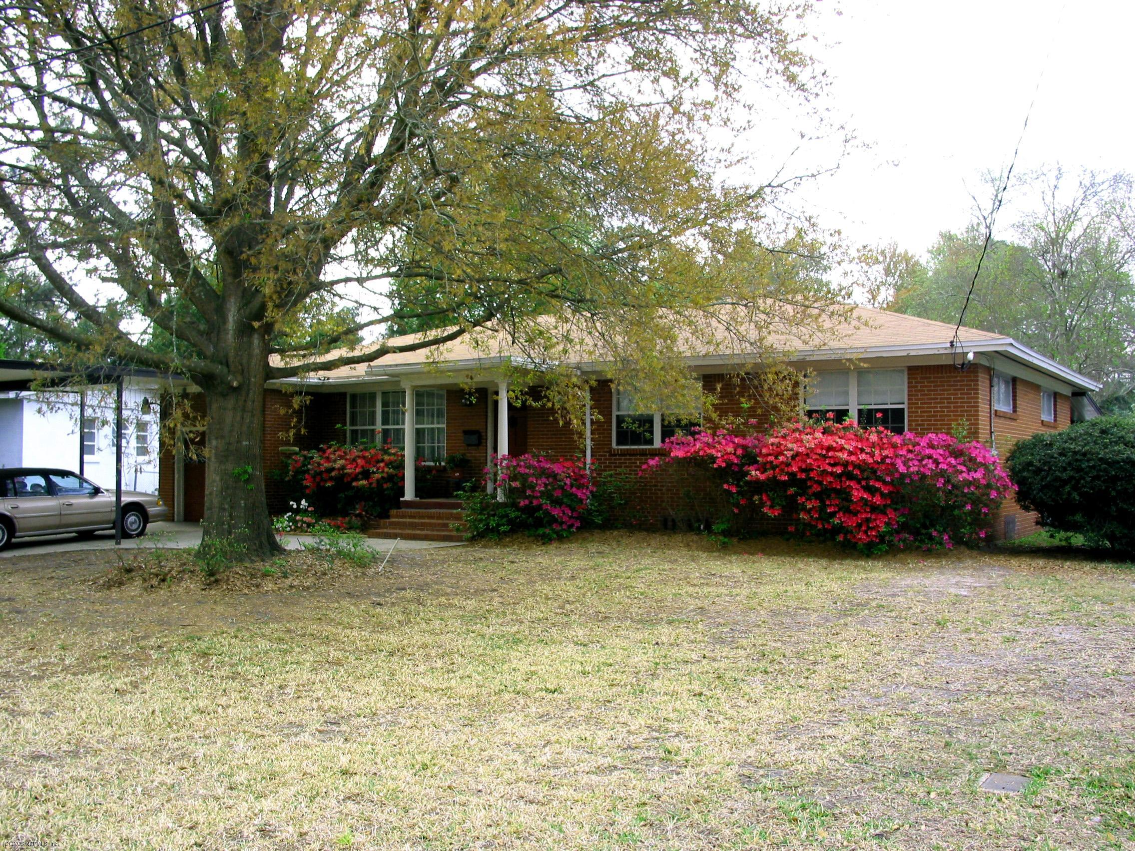 3840 Coronado Road Jacksonville, FL 32217 - Photo 1 of 2 a view of a house with backyard and porch
