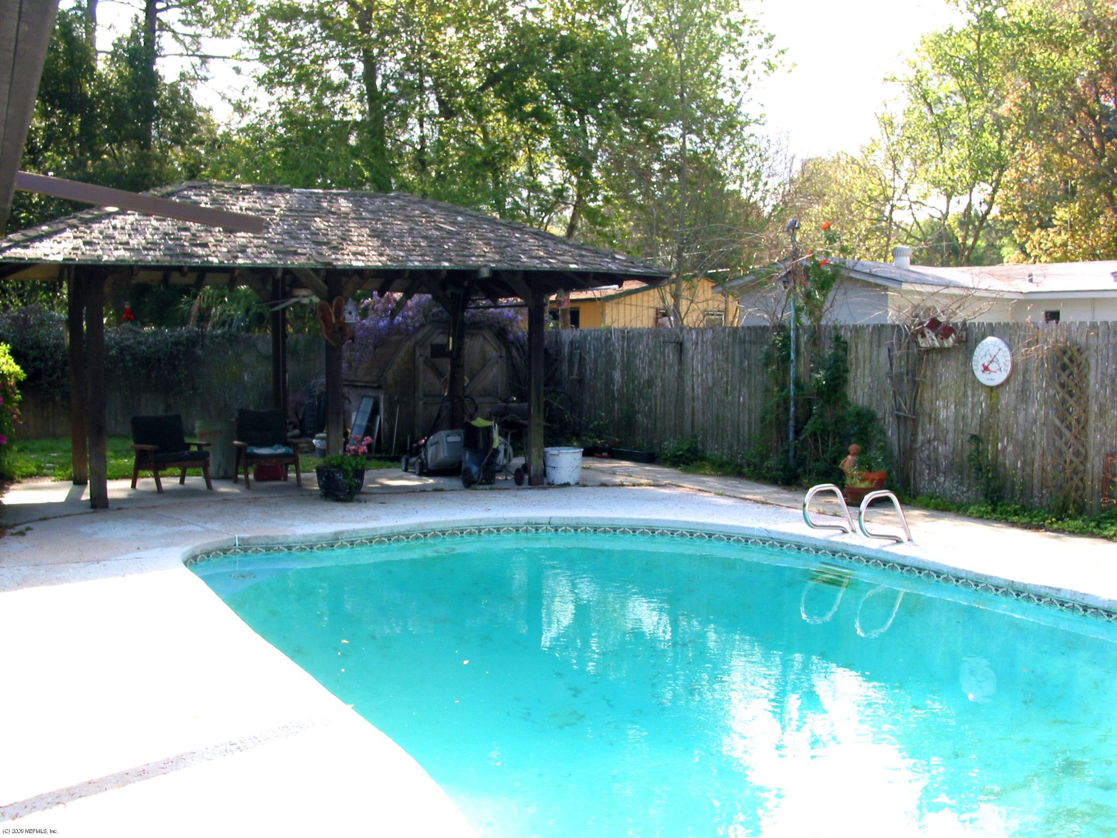 3840 Coronado Road Jacksonville, FL 32217 - Photo 2 of 2 a view of a swimming pool with a patio