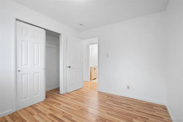 a view of a livingroom with wooden floor and closet