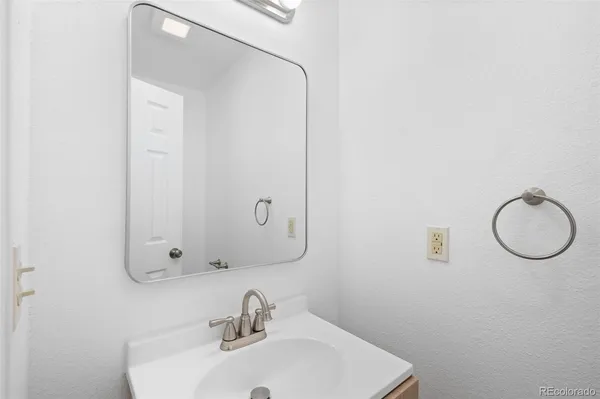 a bathroom with a sink and mirror