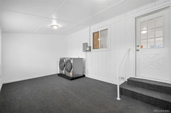 a view of room with window and stairs