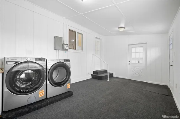 a view of livingroom with washer and dryer