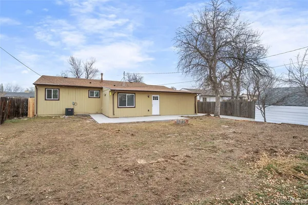 a view of a house with a yard and garage