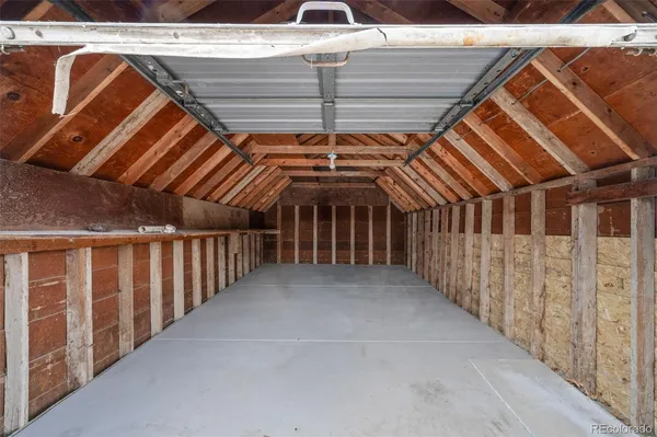 a view of a refrigerator with white wall