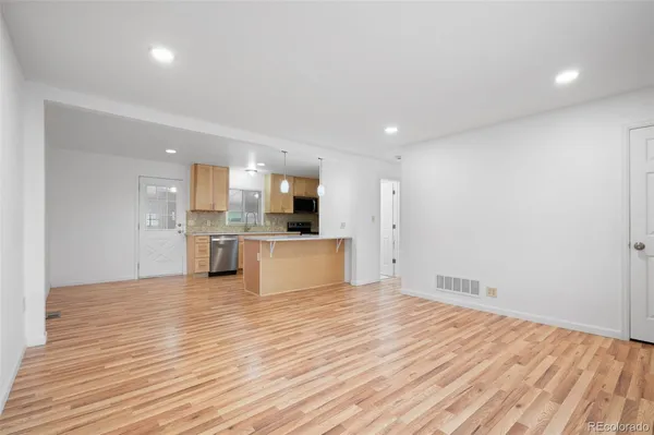 a view of kitchen with wooden floor