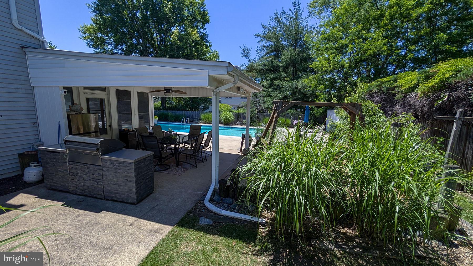 9 Wolfpack Road Hamilton, NJ 08619 - Photo 39 of 57 Serene backyard oasis with poolside charm.