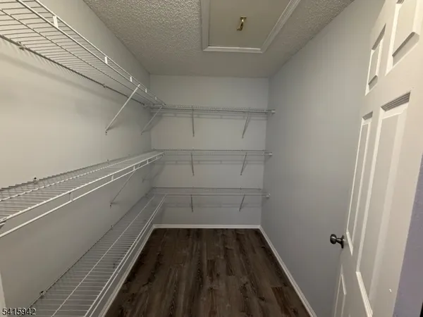 a view of a room with rack on the wall