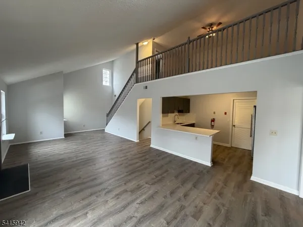 a view of kitchen with furniture and wooden floor