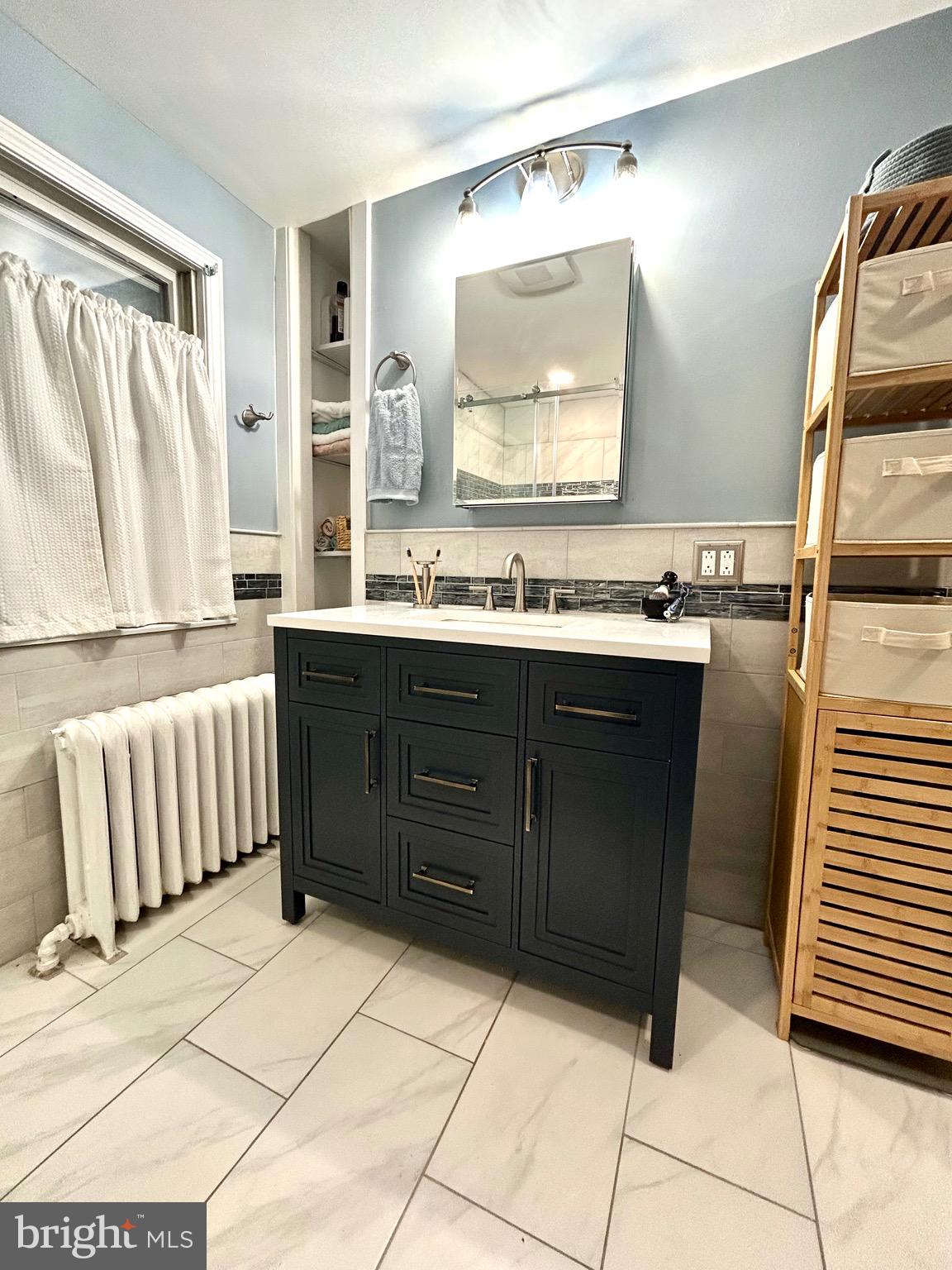 2415 Second Street Pike Newtown, PA 18940 - Photo 39 of 51 a bathroom with a sink a mirror and a bathtub