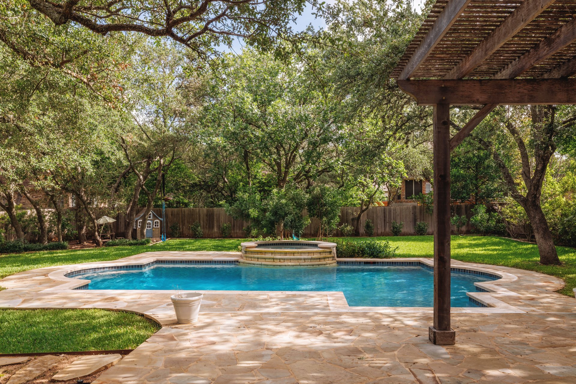 5512 Ballenton Lane Austin, TX 78739 - Photo 35 of 40 An inviting pool and spa beckon amidst a lush, private yard with mature trees.