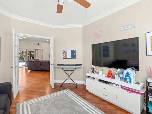 a living room with furniture and a flat screen tv
