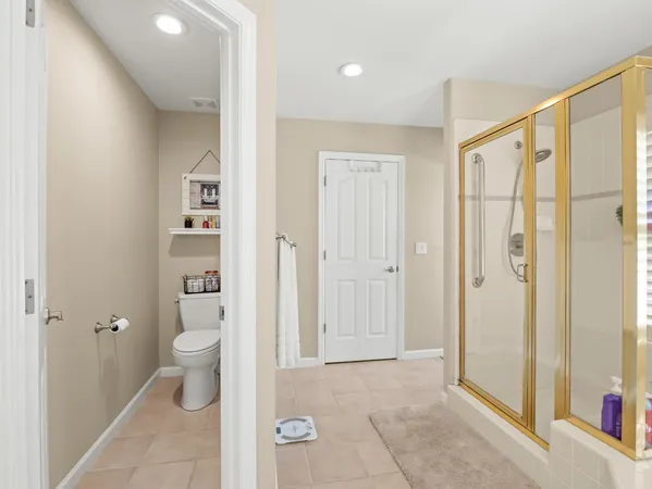 a large white kitchen with a sink and cabinets
