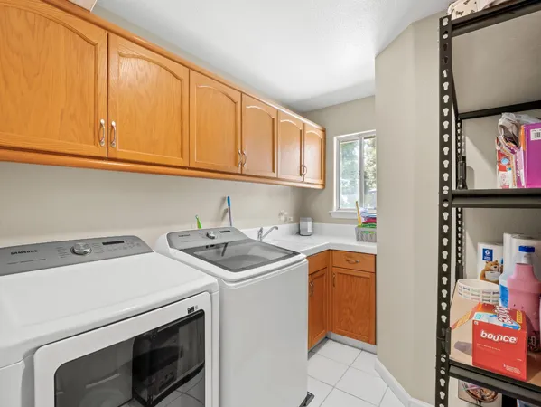 a kitchen with a sink and potted plant