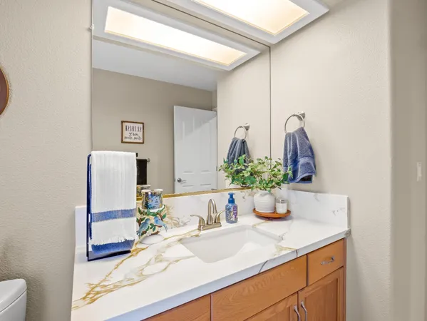a bathroom with a glass shower door