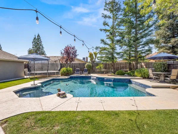 a view of yard with patio