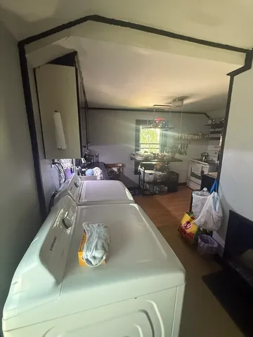 a bathroom with a toilet a sink and a mirror