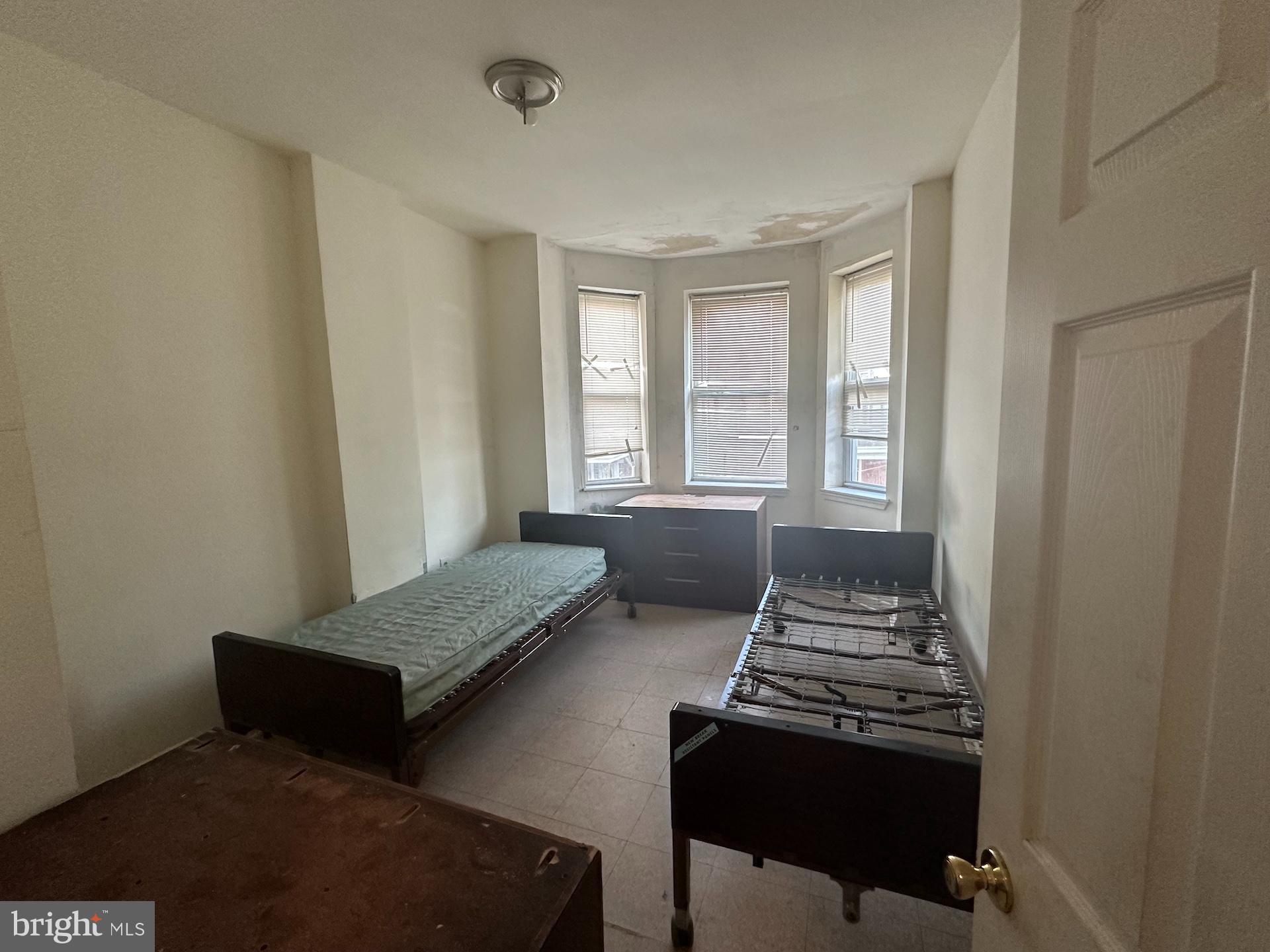 3926 Ridgewood Avenue Baltimore, MD 21215 - Photo 15 of 21 Clean, spacious bedroom #6 with bay windows.