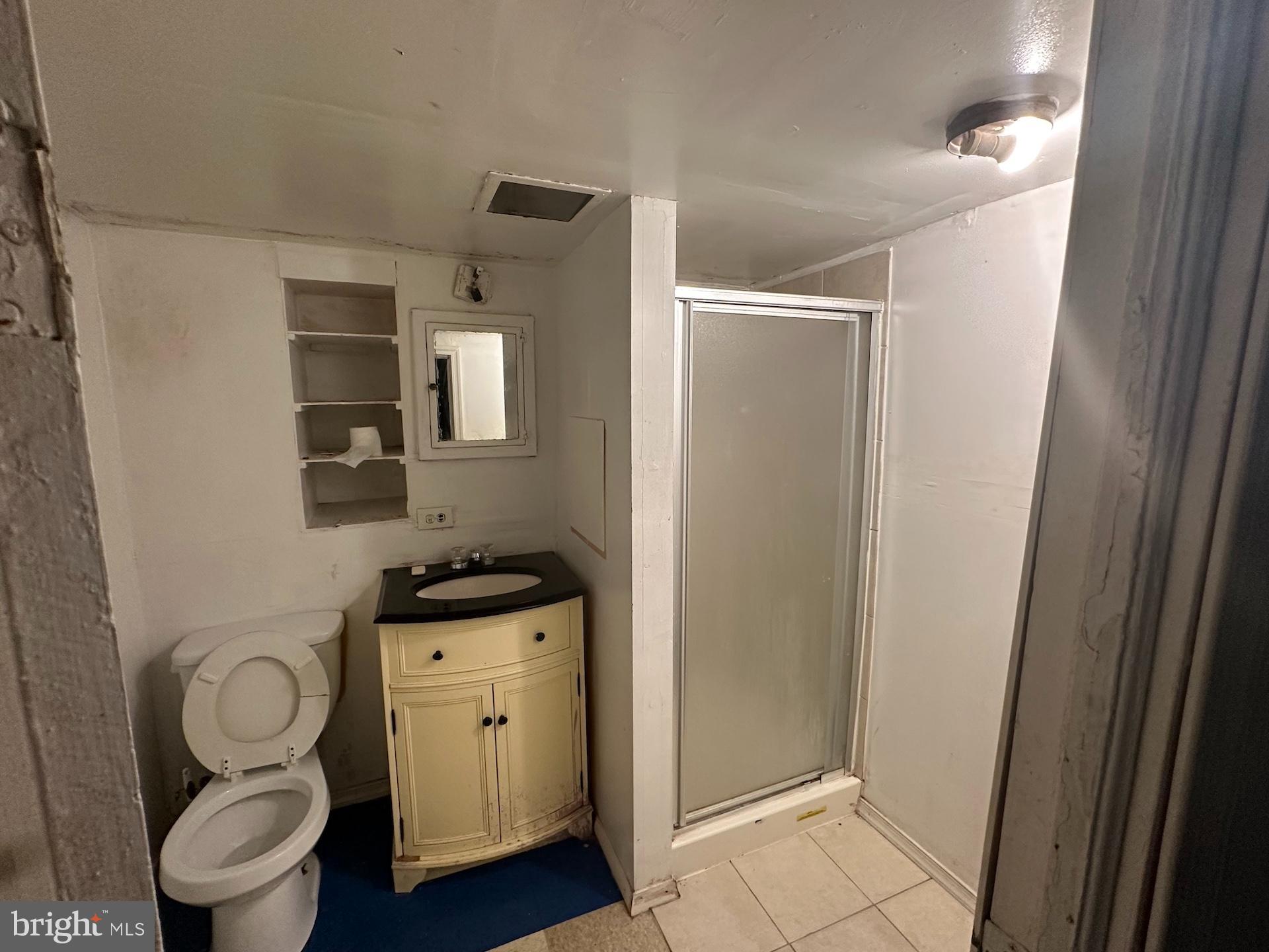 3926 Ridgewood Avenue Baltimore, MD 21215 - Photo 18 of 21 Basement bathroom with essential amenities.